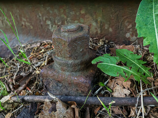 Railway track fastening, slightly rusty, close-up