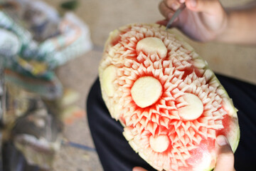 beautifully carved watermelon showcases the intricate art of Thai fruit carving.