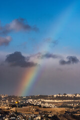 A rare winter rainbow arches over the Dome of the Rock mosque on the Temple Mount in the Old City of Jerusalem, Israel.