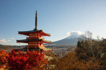 Chureito Pagoda standing tall with the majestic Mount Fuji in the background, surrounded by...