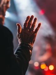 sharp image of cropped hands of man in music concert