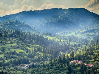 Scenic View of the Carpathian Mountains Covered by Clouds on a Sunny Day