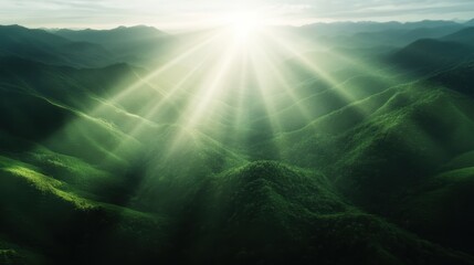 Fototapeta premium A stunning landscape showcases sun rays piercing through clouds, illuminating lush green mountains, creating a serene and captivating natural scene.