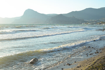 Background landscape view of Sudak Bay, the city of Sudak and its embankment in Crimea
