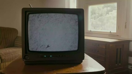 AI-generated of a retro TV with static noise sits on a table in a softly lit vintage living room - Powered by Adobe