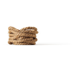 A neatly coiled piece of natural rope, showcasing its texture and form.