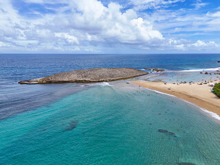 Large, protected bay with sandy beach at Montones Beach near Isabela on the northwest side of the island of Puerto Rico in the Caribbean. 