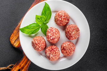 Meatballs raw meat pork, beef, chicken fresh delicious gourmet food background on the table rustic food top view copy space