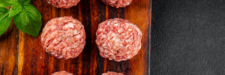 Meatballs raw meat pork, beef, chicken fresh delicious gourmet food background on the table rustic...