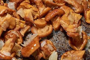 Hot mushroom dish – chanterelles fried with onions in oil. A fragrant dish of fried chanterelles...