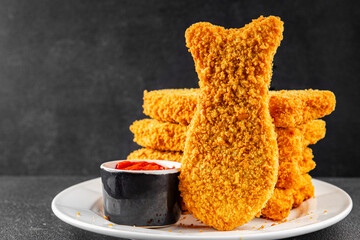 Fish sticks fishs shaped breaded fish nuggets fast food fresh delicious gourmet food background on...