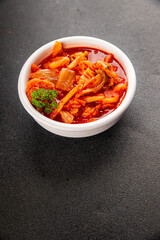 Kimchi pickled cabbage salad spicy savory vegetables fresh delicious gourmet food background on the table rustic food top view copy space vegetarian and vegan food