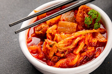 Kimchi pickled cabbage salad spicy savory vegetables fresh delicious gourmet food background on the table rustic food top view copy space vegetarian and vegan food