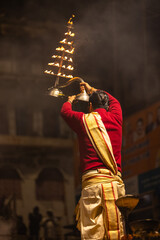 Ganga aarti, Portrait of an young unidentified male priest performing holy river ganga evening...