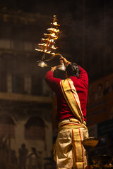 Ganga aarti, Portrait of an young unidentified male priest performing holy river ganga evening...