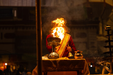 Ganga aarti, Portrait of an young unidentified male priest performing holy river ganga evening...