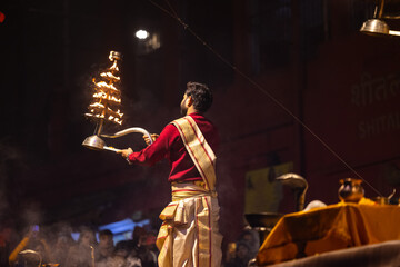 Ganga aarti, Portrait of an young unidentified male priest performing holy river ganga evening...