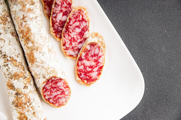 Dry-cured sausage pork meat smoked food fresh delicious gourmet food background on the table rustic...