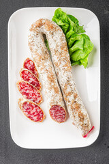 Dry-cured sausage pork meat smoked food fresh delicious gourmet food background on the table rustic food top view copy space