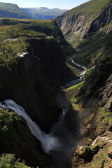 Landscape photo with a view of a canyon, mountains, the Bjoreiro River and the Voringsfossen...