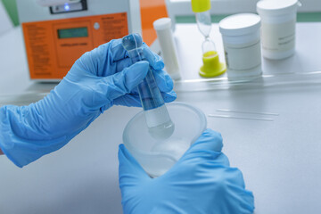 Lab Technician Mixing Chemical Compound with Mortar and Pestle for Pharmaceutical or Chemistry...