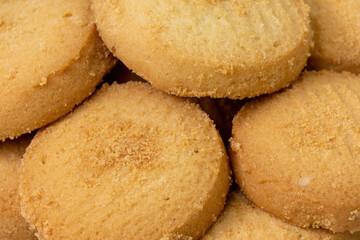 Close-up of delicious round biscuits. Macro texture of tasty cookies.