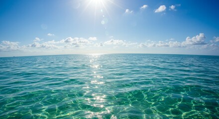 Sunlight shimmering on the ocean surface creating a peaceful water scene