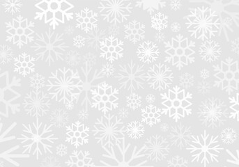 Delicate snowflakes are scattered across a soft, light-colored background, creating a festive Christmas ambiance suitable for holiday decorations and designs