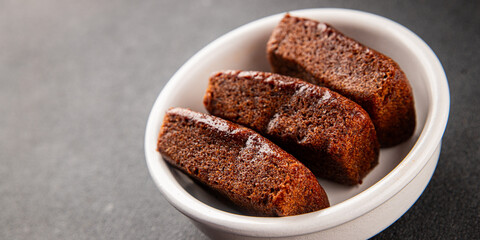 Financier biscuit chocolate cookie sweet dessert fresh delicious gourmet food background on the table rustic food top view copy space