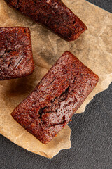 Financier biscuit chocolate cookie sweet dessert fresh delicious gourmet food background on the table rustic food top view copy space