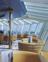 Luxurious modern observation or panorama lounge with floor to ceiling windows onboard expedition...