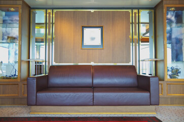 Luxurious modern observation or panorama lounge with floor to ceiling windows onboard expedition...