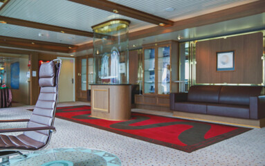 Luxurious modern observation or panorama lounge with floor to ceiling windows onboard expedition...