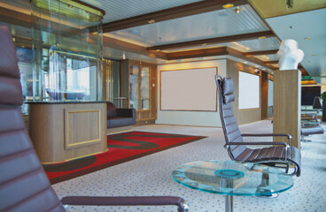 Luxurious modern observation or panorama lounge with floor to ceiling windows onboard expedition...