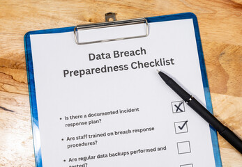 Cybersecurity Checklist Document with Pen – Data Breach Readiness and Protection Scene