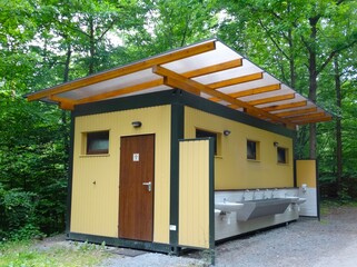 Public shower and toilet in a camp in the forest