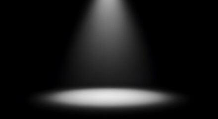 Dramatic spotlight illuminates a stage in the darkness, creating a sense of mystery