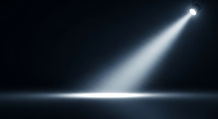 Dramatic Spotlight Illuminates Empty Stage with Dust Particles and Dark Backdrop