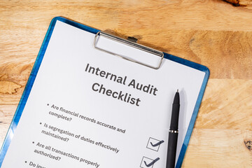 Financial Internal Audit Checklist Paper with Pen – Corporate Finance Review Concept