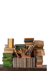 Stacks of many books on a shelf or table on an isolated background. Concept of library, reading, old classic literature