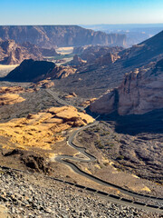 A winding road cuts through the valley in Al Ula, Saudi Arabia.