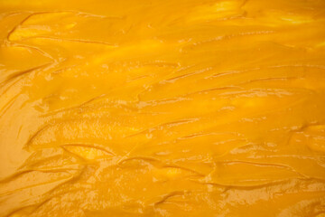 Yellow sauce splashes as a background.