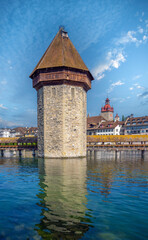 The 14th century water tower (Wasserturm) and the chapel bridge (Kappelbrücke) in the old town of Lucerne (Luzern), Switzerland