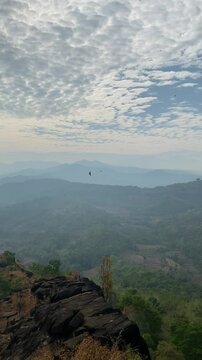 Sunrise in nature, mountain trees and forest aerial view and beautiful nature scenery. Natural landscape backgrounds of wild environment for travel. Clouds over the forest. 