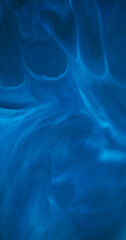 Defocused stream. Blue mix. Acrylic ink dissolving abstract swirl. Color enamel art emulsion curl wave pigment blur wet background.