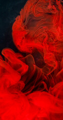 Art fog. Cloud dye. Bright red fume emulsion curl stream blending pigment. Art liquid paint spill abstract fluid defocused black background.