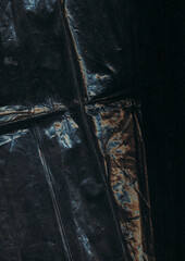 Crumpled background. Rust texture. Blue orange color light flare dust scratches old film used...