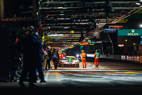 Ferrari 488 GTE on the pit lane during pit stop at the night