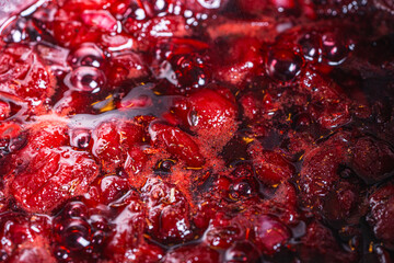 Background with the texture of jam or jam made of cherries and strawberries.