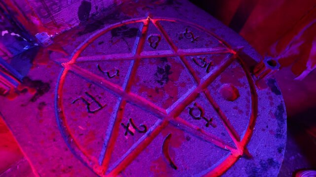A pentagram with fire in a dark room. Quest